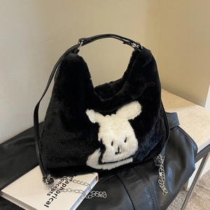 Minimalist black faux fur tote bag featuring a large white cartoon rabbit face and chain strap
