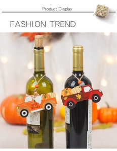 Detail of wooden truck wine bottle hangers with Give Thanks text for harvest fall decor