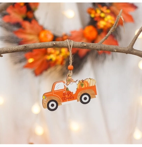 Detail of wooden pumpkin truck ornament with gnome and Give Thanks text for Fall