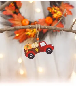 Detail of wooden red truck hanging ornament with pumpkins for fall harvest festival decor