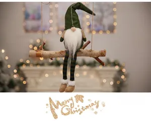 Green Christmas gnome plush toy sitting on a wooden swing with holiday background