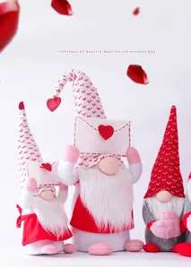 Close-up of Valentine's Day gnomes with knitted hats and heart envelope details