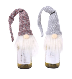 Close-up of knit Christmas gnome wine bottle covers with red dots and grey textures
