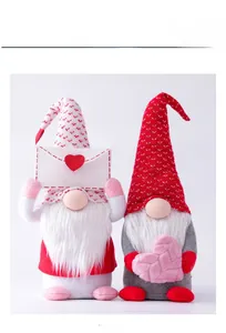 Pair of Valentine gnomes with heart patterns and plush heart accessory on a white background