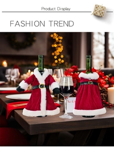 Detail of Christmas wine bottle covers in Santa suit and dress styles with velvet texture