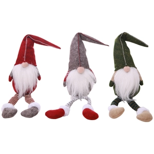 Three long-legged Christmas gnomes in red, grey and green for festive window decoration