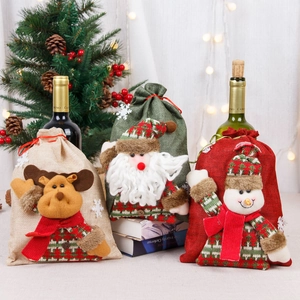 Tre sacchetti regalo natalizi in iuta con Babbo Natale, Renna e Pupazzo di neve in 3D