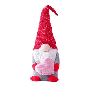 Valentine's gnome plush toy with red knitted heart hat and pink heart for window display