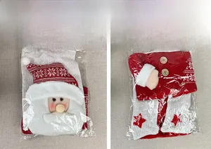 Detail of Santa Claus and snowflake knitted chair covers with wooden buttons