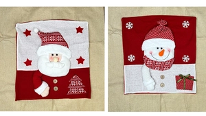 Detail of 3D Santa and Snowman knitted chair covers with wood buttons and embroidery