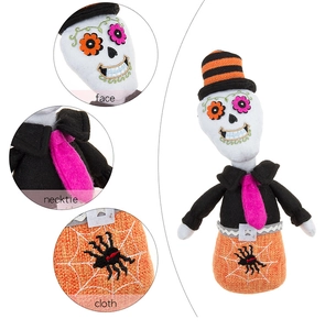 Close-up of Halloween skull doll with spider embroidery and orange striped hat detail