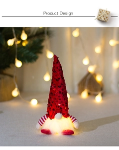 Detail of sequined red Christmas gnome with warm LED light and striped knit arms