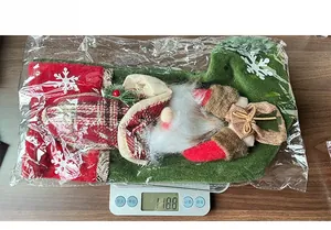 Christmas gnome stocking weight check on a digital scale showing 118.8g in detail