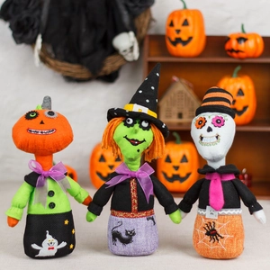 Halloween plush doll set with pumpkin, witch, and skeleton motifs for holiday tabletop decor