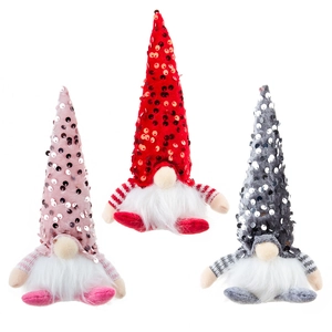 Three sequined Christmas gnomes with glowing LED lights and long hats on white background