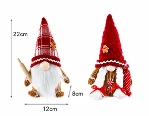 Pair of Christmas gingerbread gnomes with knitted hats and holiday props 22cm tall
