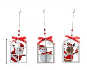 Detail of Christmas wooden window ornaments with Santa, Snowman and Reindeer motifs