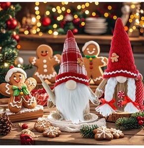 Detail of Christmas gingerbread gnomes with red knit hats and white braids for home decor