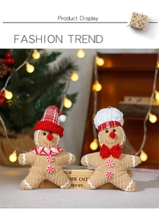 Detail of plush gingerbread men dolls with chef hats and scarves for Christmas decor