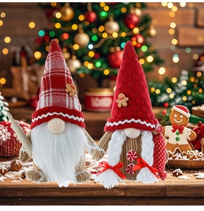 Close-up of plush Christmas gnomes with gingerbread motifs and festive kitchen accessories