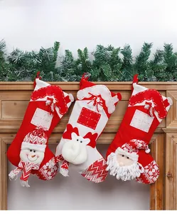 Detailed knit Christmas stockings with 3D Santa, Snowman and Deer on wooden mantel