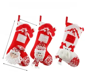 Detailed size view of a 3-piece set of knitted Christmas stockings with Santa and Reindeer