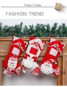 Detailed view of red and white knit Christmas stockings with 3D Santa, deer, and snowman
