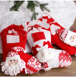 Detailed knit Christmas stockings set featuring plush Santa, reindeer and snowman figures