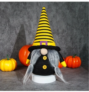 Detailed view of Halloween gnome with yellow striped hat and grey braided beard decor