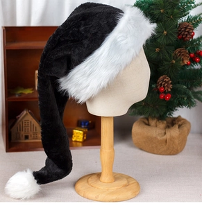 Close-up of a 75cm long black plush Christmas hat with white faux fur trim and pompom