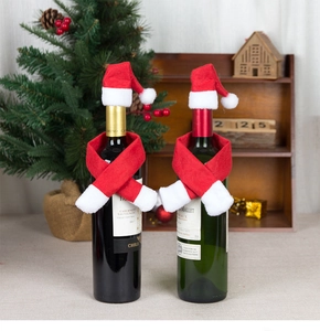 Detail of Christmas wine bottle decoration set with mini hats and red white scarves