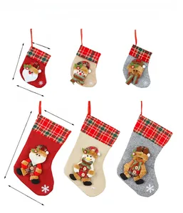 Detailed size comparison of embroidered Christmas stocking gift bags with festive patterns