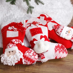 Three-pack festive red and white knitted Christmas stockings with 3D Santa and reindeer