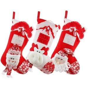 Three knitted Christmas stockings with 3D Santa Snowman and Reindeer fireplace decorations