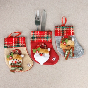 Christmas stocking silverware holders featuring 3D Santa, snowman, and reindeer designs
