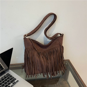 Brown faux suede hobo bag with long fringes and wide shoulder strap for winter fashion