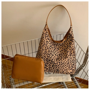 Leopard print tote bag and brown zip pouch shown inside a metal shopping cart