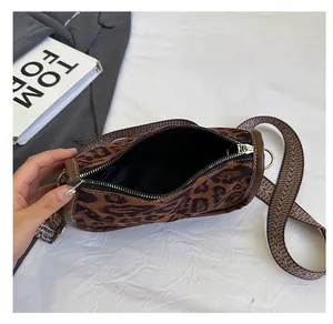 Leopard print crossbody bag interior view showing large capacity and geometric strap