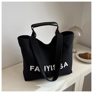 Close-up of FANIYISSA printed canvas tote bag with sturdy handles and premium texture