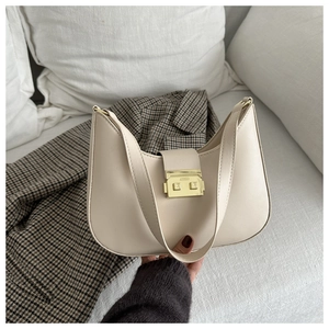 Close-up of off-white hobo bag featuring a retro gold square buckle and smooth PU leather