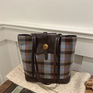 Large plaid tote bag with brown leather trim and golden N buckle on soft fabric