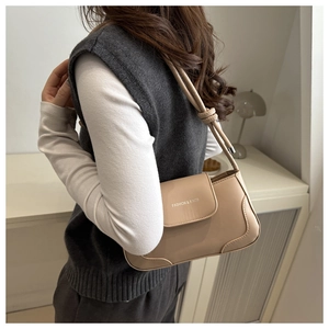 Detail of khaki PU leather shoulder bag with knotted strap and FASHION & BAGS logo