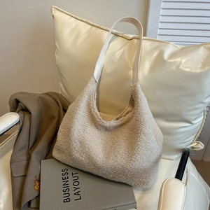 Winter stylish beige plush hobo bag with white leather strap and soft fleece texture