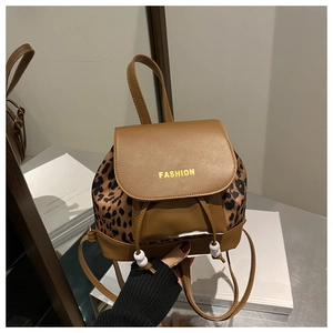 Detail of mini leopard print backpack with PU leather flap and decorative white beads