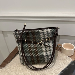 Retro green tweed bucket bag with dark brown leather straps for autumn winter 2024 fashion