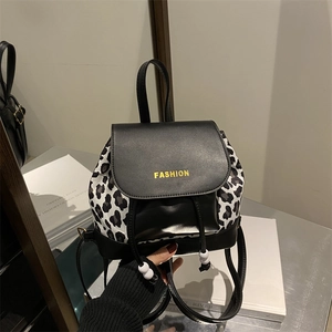 Women's vintage leopard print backpack with faux leather flap and drawstring closure