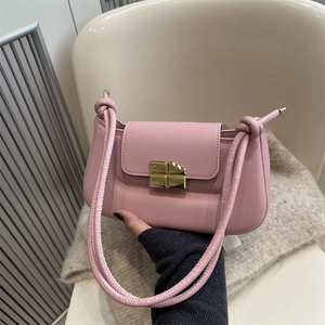 Light pink leather underarm bag with unique gold chocolate bar shaped metal buckle