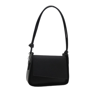 Minimalist black crossbody bag with woven texture flap and adjustable shoulder strap