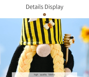 Detail display of high quality fabric on honey bee gnome with wings and wooden stirrer