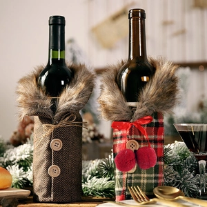 Detail of Christmas wine bottle covers with faux fur collars and festive patterns